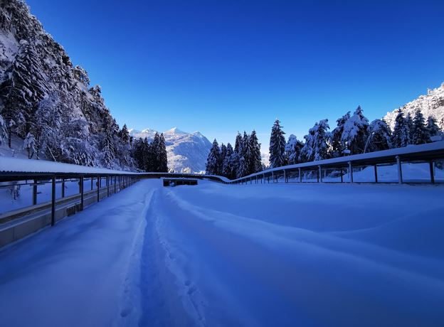 Alpine bobsleigh on the ice channel in Bludenz